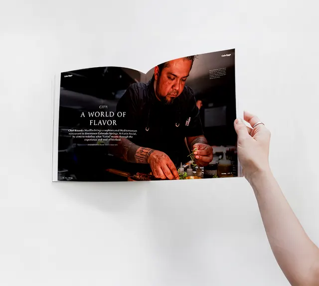 A reader holding Colorado Springs Magazine